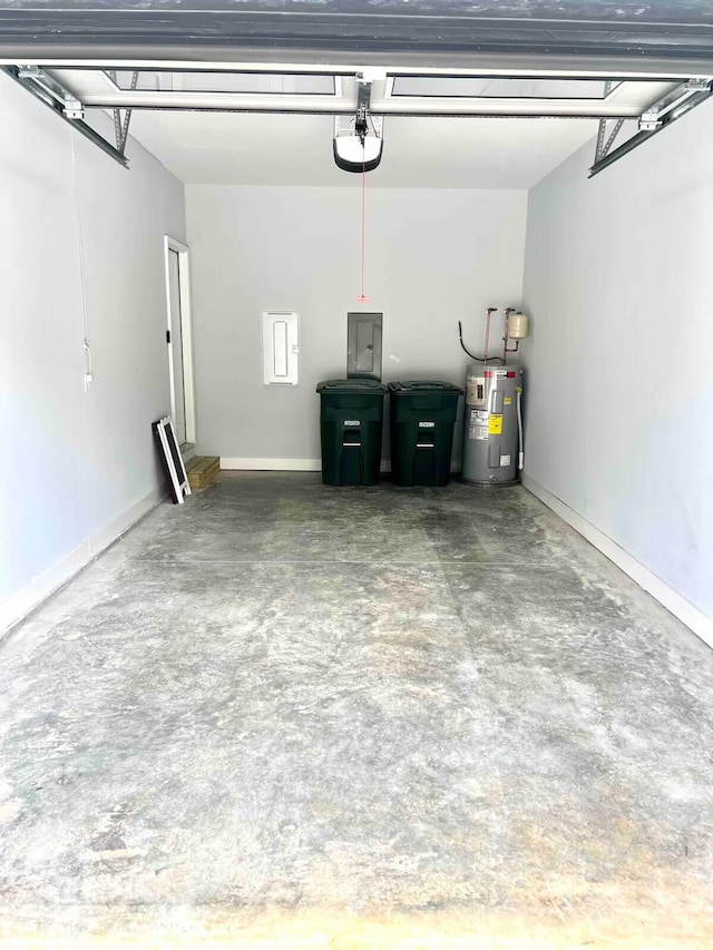 garage featuring water heater and electric panel