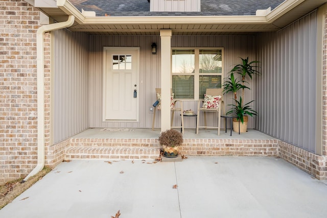 view of exterior entry featuring a porch