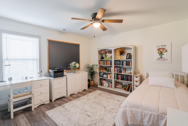 bedroom with ceiling fan and wood-type flooring