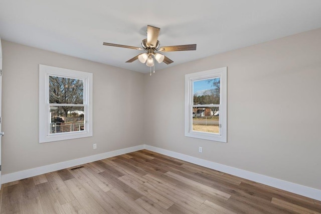 unfurnished room with ceiling fan and light hardwood / wood-style flooring