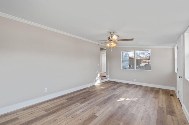 spare room featuring ceiling fan, ornamental molding, lofted ceiling, and light hardwood / wood-style floors