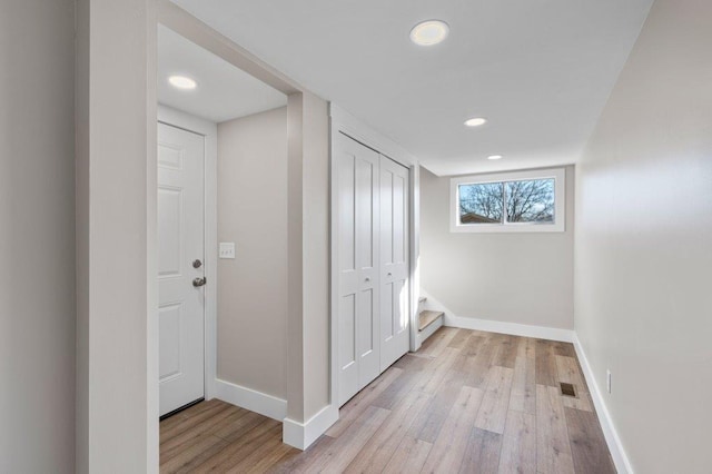 hallway with light wood-type flooring