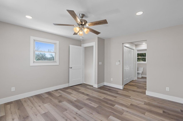 empty room featuring ceiling fan and light hardwood / wood-style flooring