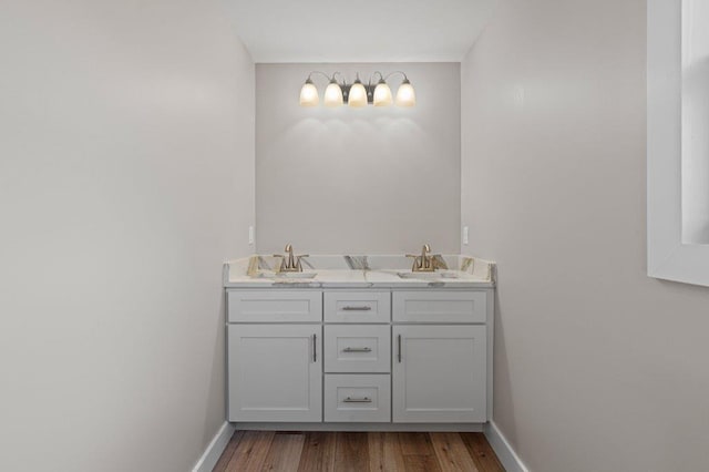 bathroom featuring hardwood / wood-style flooring and vanity