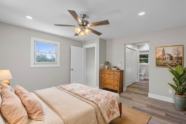 bedroom with ceiling fan, a closet, and hardwood / wood-style floors