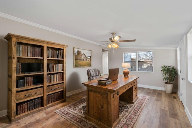 office featuring ceiling fan, vaulted ceiling, crown molding, and hardwood / wood-style flooring