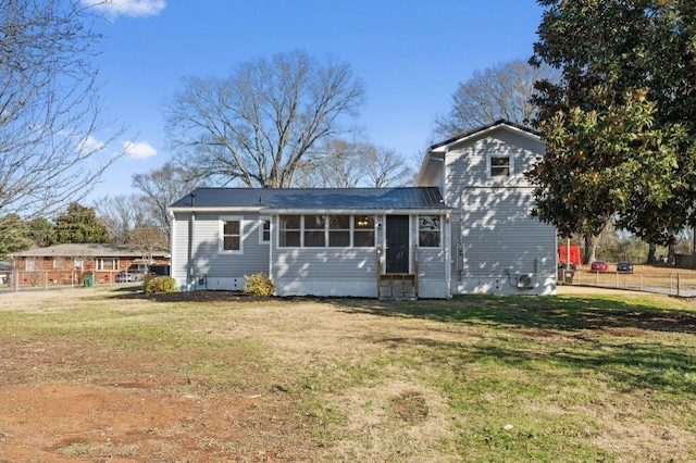 back of house featuring a yard