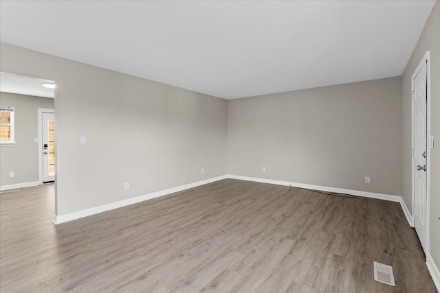 spare room featuring light wood-type flooring