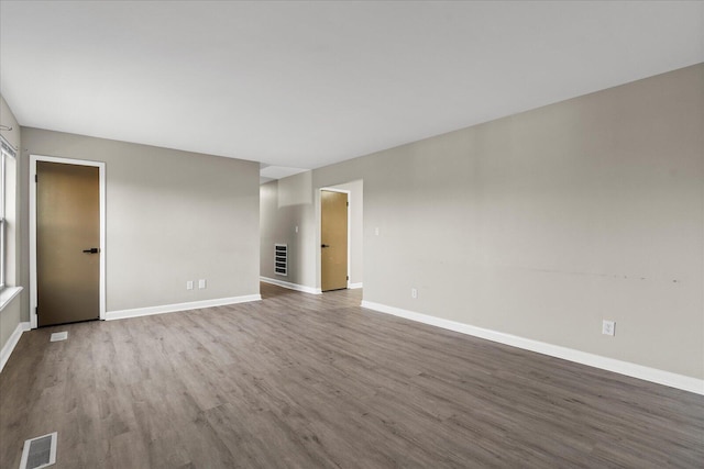 unfurnished room featuring wood-type flooring