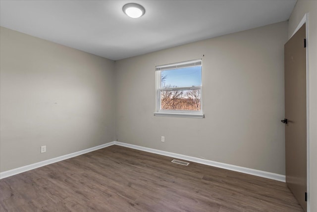 unfurnished room featuring hardwood / wood-style floors