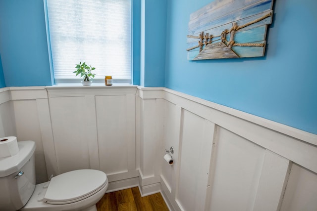 bathroom with toilet and hardwood / wood-style floors