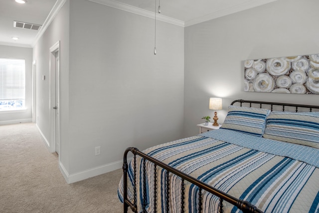 carpeted bedroom with ornamental molding