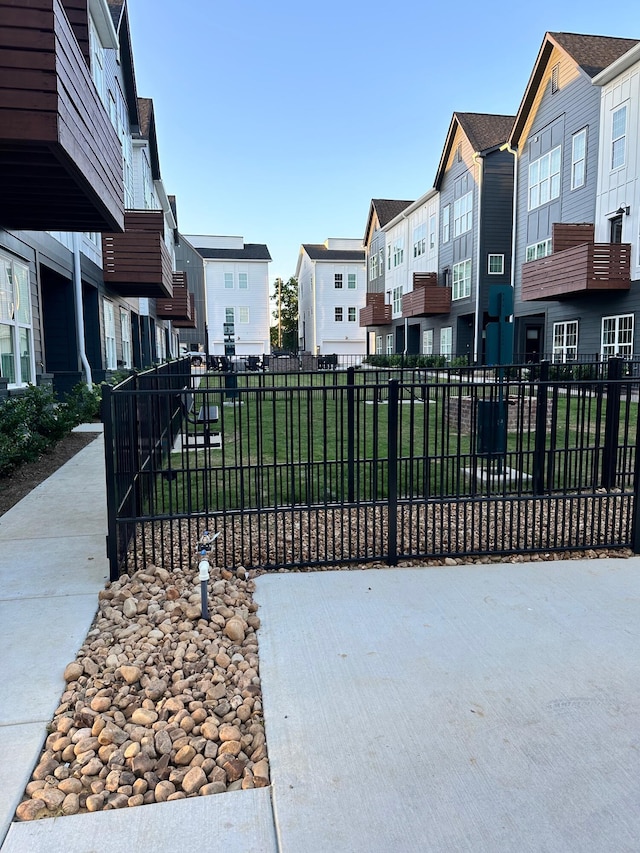 view of gate featuring a yard