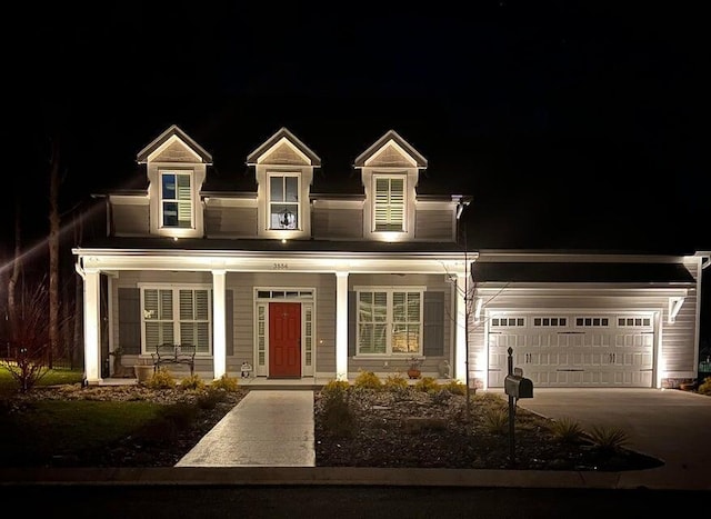 cape cod-style house featuring a garage