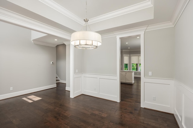 unfurnished dining area with dark wood-type flooring, crown molding, and an inviting chandelier