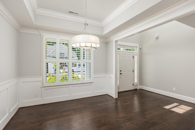 entrance foyer with dark wood-type flooring, plenty of natural light, and a chandelier