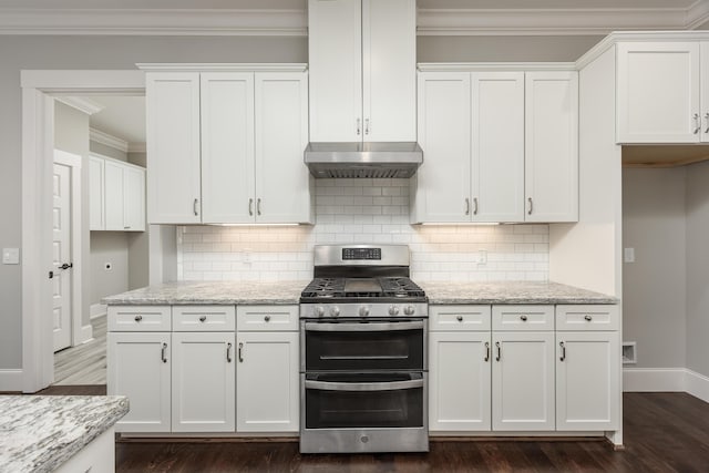 kitchen featuring white cabinetry, light stone countertops, range with two ovens, and range hood