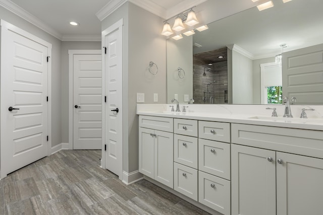 bathroom featuring hardwood / wood-style flooring, an enclosed shower, vanity, and ornamental molding