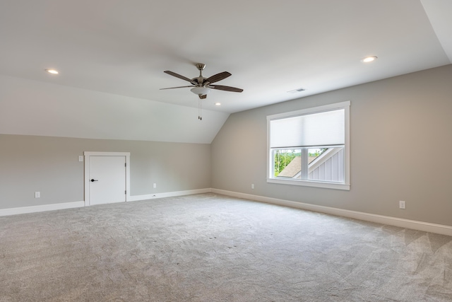 bonus room with ceiling fan, light carpet, and lofted ceiling