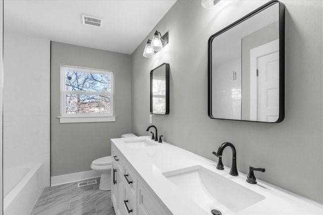 full bathroom with toilet, vanity, and bathing tub / shower combination