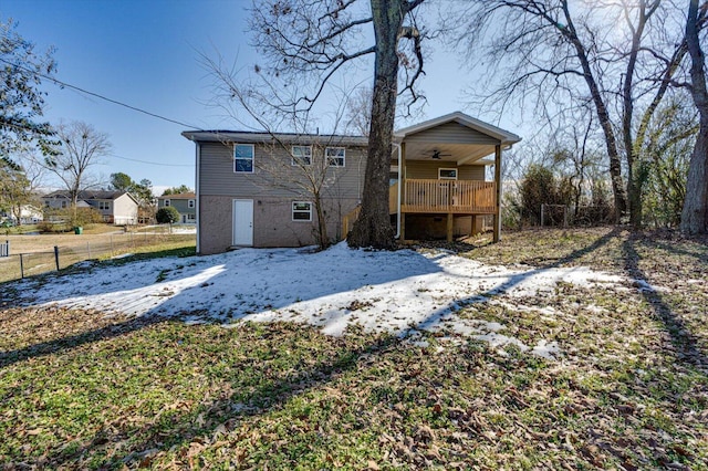 back of property featuring ceiling fan