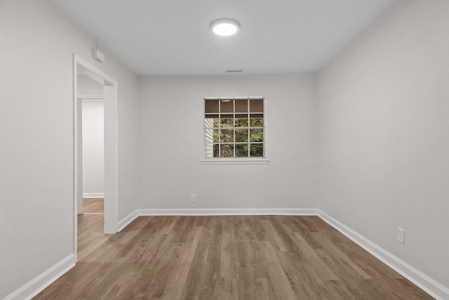 empty room with wood-type flooring