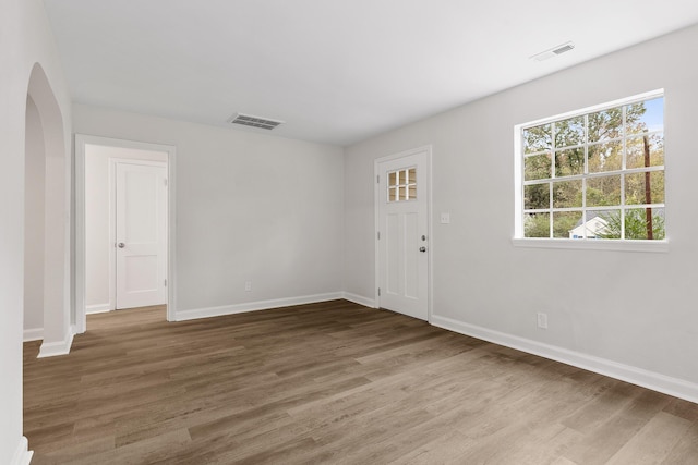 unfurnished room featuring hardwood / wood-style floors