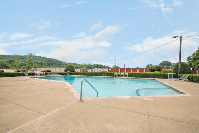 view of swimming pool featuring a patio area