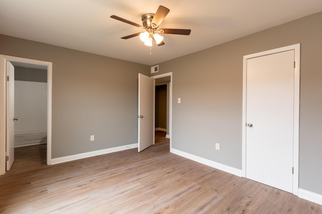 unfurnished bedroom with ceiling fan and light hardwood / wood-style floors