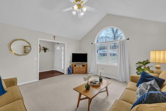 living room featuring vaulted ceiling, light carpet, and ceiling fan