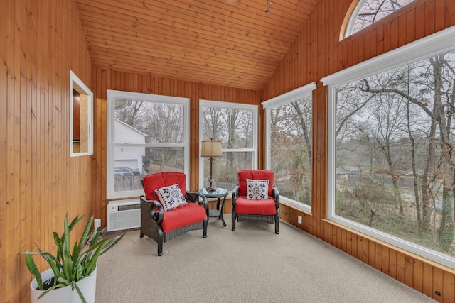 sunroom with wood ceiling, a wall mounted AC, and vaulted ceiling