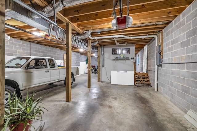 garage with a garage door opener and refrigerator