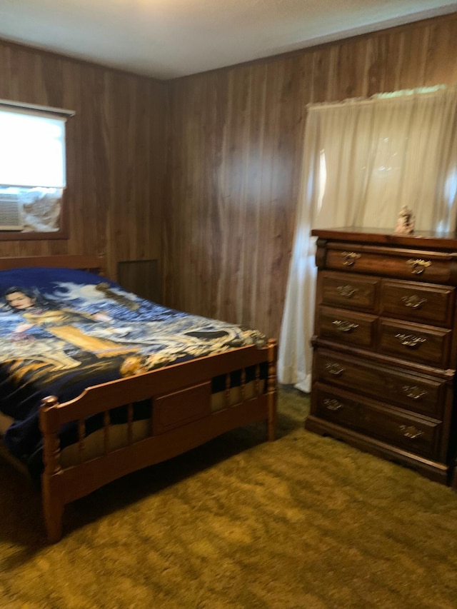 bedroom with carpet and wooden walls