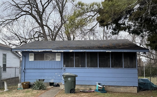 view of front facade with a sunroom