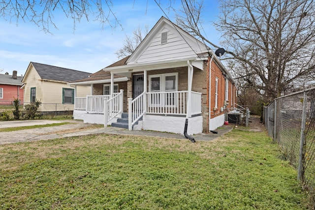 bungalow-style house featuring a front yard and a porch