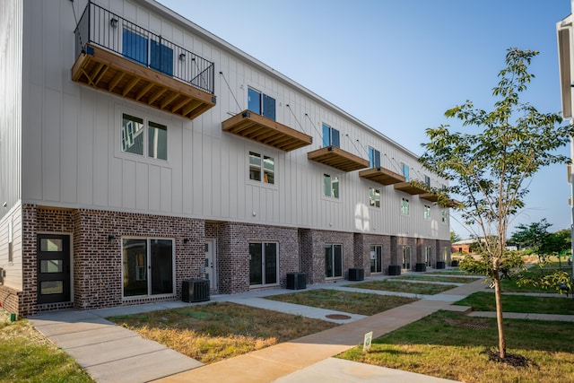 view of building exterior featuring central AC