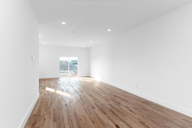 spare room featuring light hardwood / wood-style floors