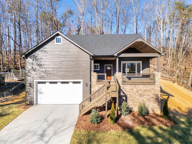 view of front of property featuring a garage and a porch