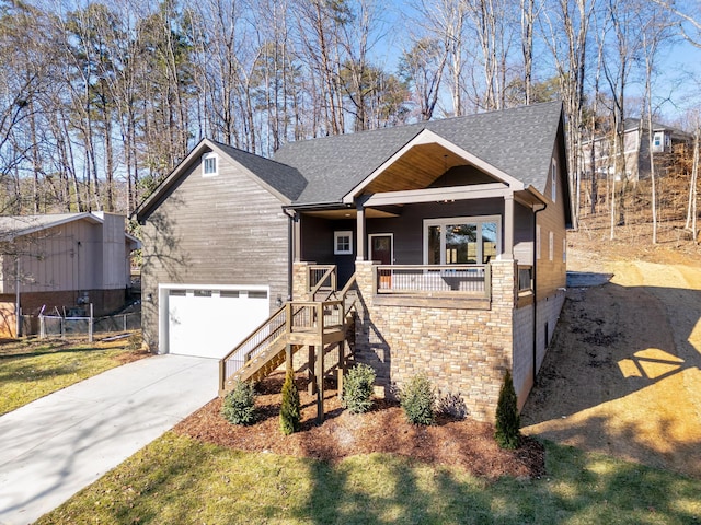 craftsman-style house featuring covered porch and a garage