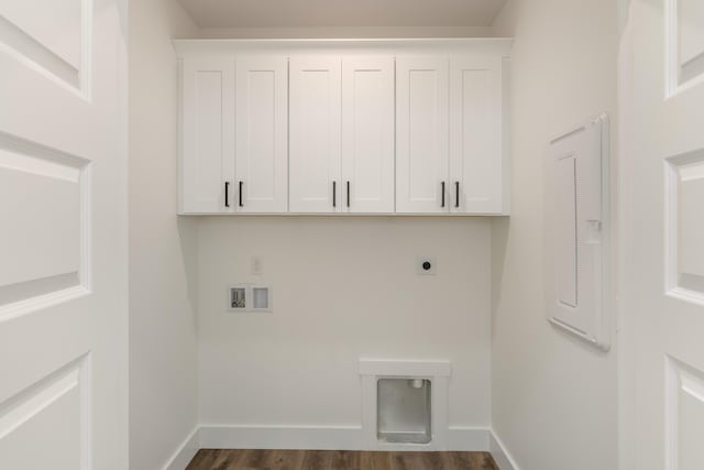 clothes washing area featuring dark hardwood / wood-style floors, electric dryer hookup, hookup for a washing machine, cabinets, and electric panel