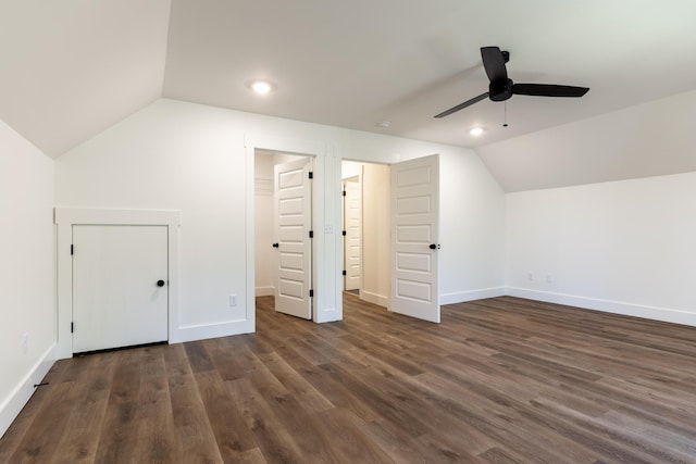 bonus room with ceiling fan, vaulted ceiling, and dark wood-type flooring