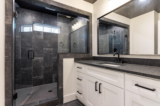 bathroom with an enclosed shower and vanity