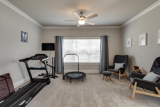 exercise area with light carpet, crown molding, and ceiling fan