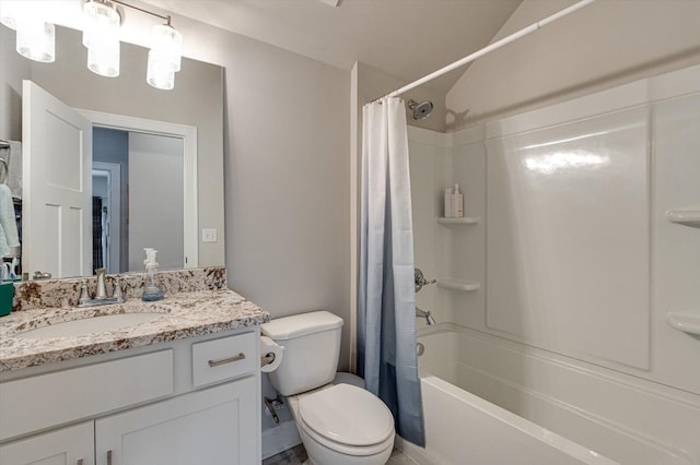 full bathroom featuring lofted ceiling, vanity, toilet, and shower / bath combo with shower curtain