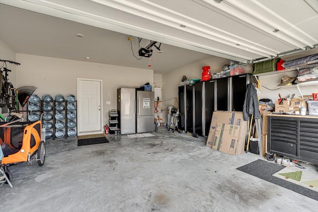 garage featuring a garage door opener and stainless steel refrigerator