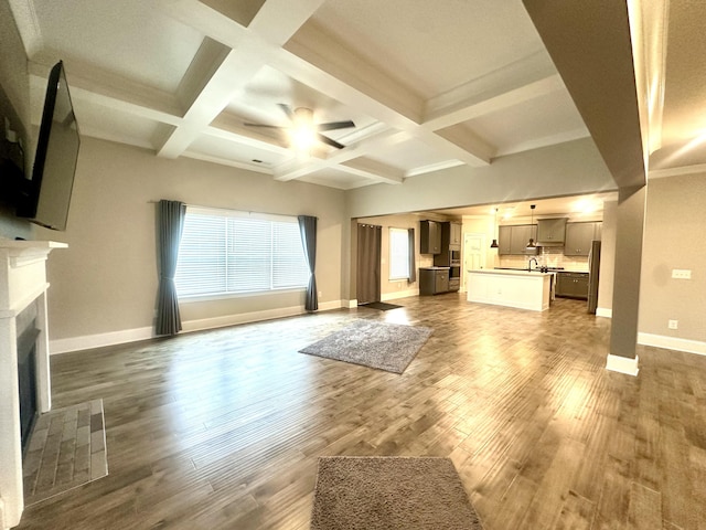 7574 Catchfly Dr Unit 274, Ooltewah, TN 37363 - unfurnished living room featuring a ceiling fan, a fireplace with flush hearth, wood finished floors, beamed ceiling, and baseboards