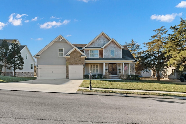 view of front of house featuring a garage and a front yard