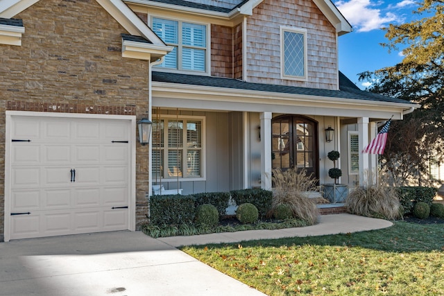 view of front of property featuring a porch and a garage