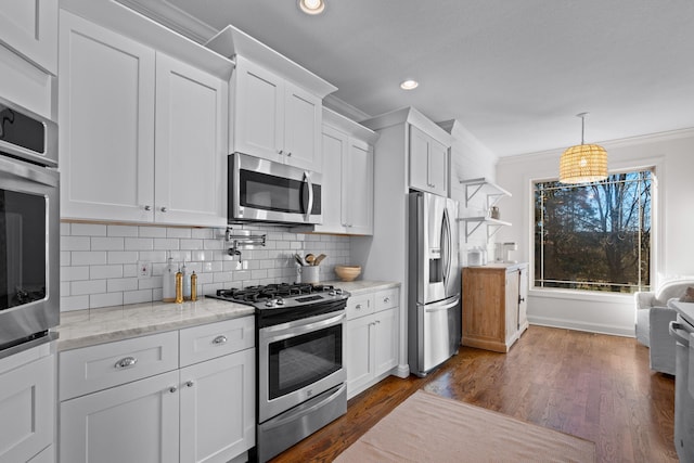 kitchen with white cabinetry, stainless steel appliances, backsplash, dark wood-type flooring, and light stone countertops