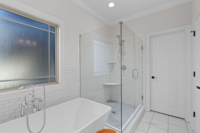 bathroom featuring ornamental molding, shower with separate bathtub, and tile patterned flooring